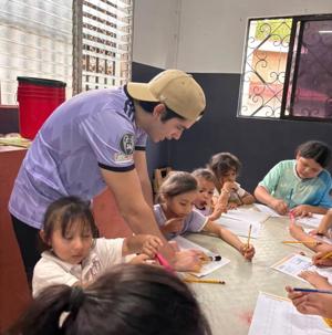 A volunteer at the worksheet table